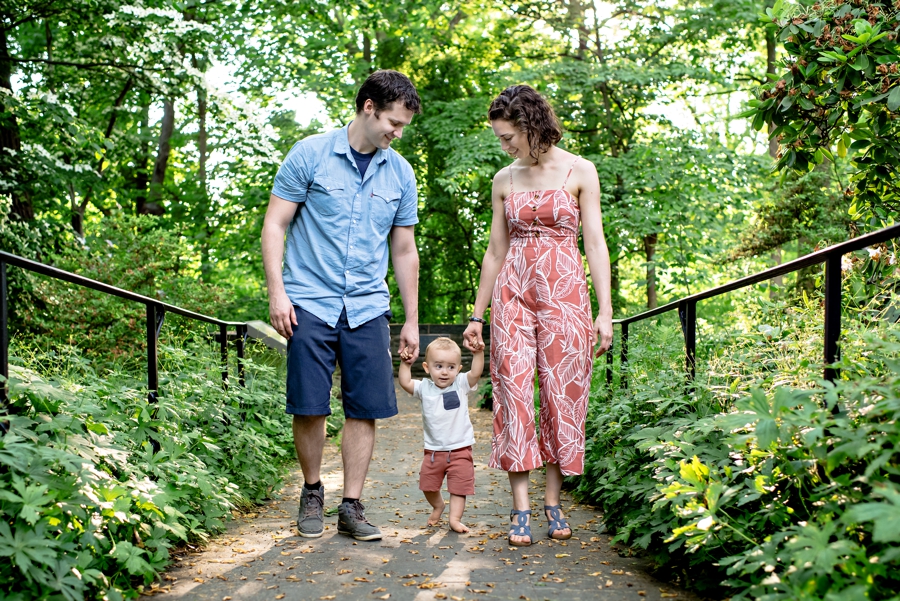 An adorable family walking through the gardens at Scott Arboretum.
